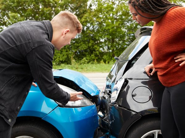 Two Angry Motorists Arguing Over Responsibility For Car Accident